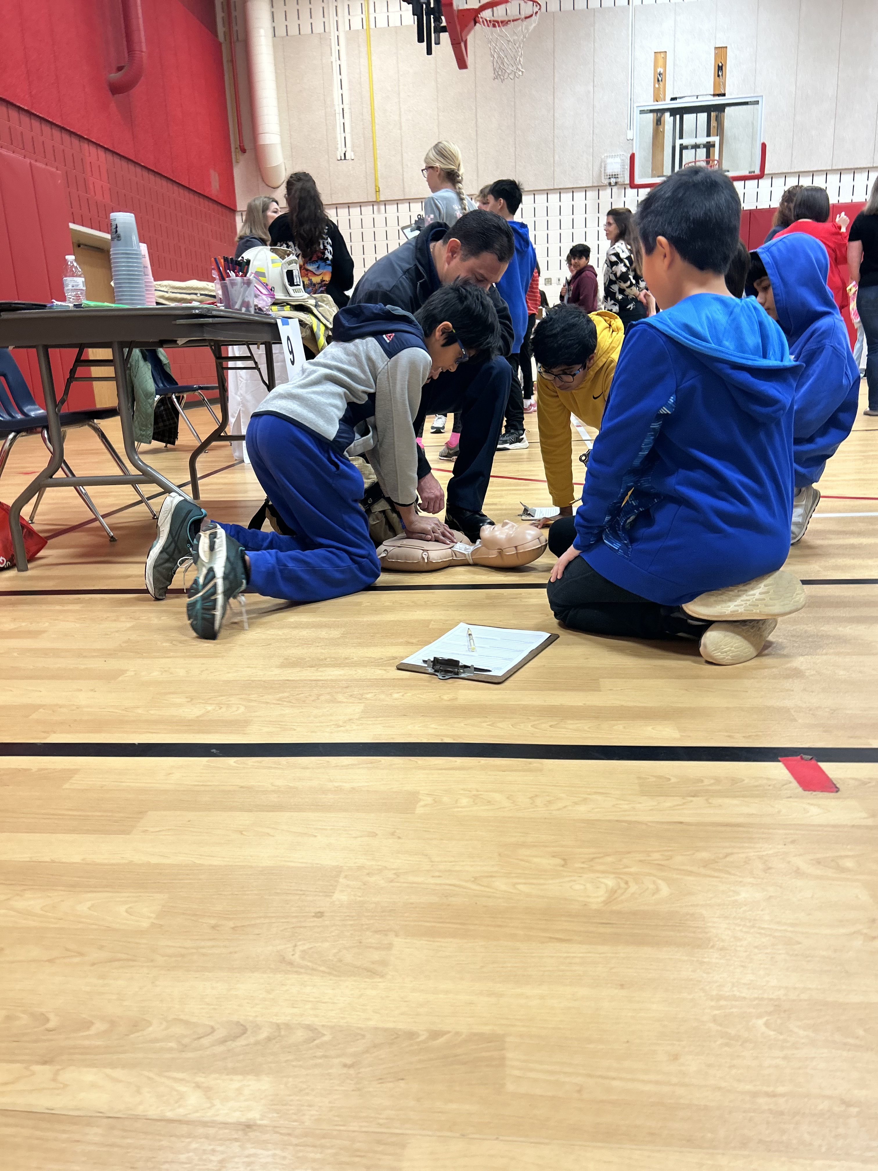 Students practicing CPR on a dummy